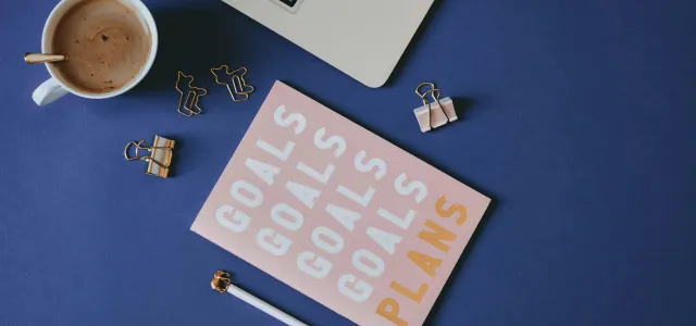 white and brown computer keyboard beside white ceramic mug on blue table by Content Pixie courtesy of Unsplash.